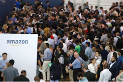 In this Sept. 17, 2019, photo job seekers line up to speak to recruiters during an Amazon job fair in Dallas. On Friday, Oct. 4, the U.S. government issues the September jobs report.