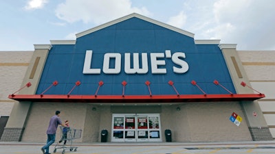 In this June 29, 2016, file photo, customers walk toward a Lowe’s store in Hialeah, Fla.