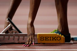 Patience Okon George, of Nigeria adjusts her starting blocks before a women's 400 meter heat at the World Athletics Championships in Doha, Qatar, Monday, Sept. 30, 2019.
