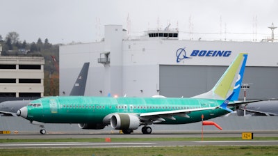 In this April 10, 2019, file photo a Boeing 737 MAX 8 airplane rolls toward takeoff before a test flight at Boeing Field in Seattle. Reported Wednesday, Oct. 2, a Boeing engineer filed an internal complaint alleging that company managers rejected a backup system that might have alerted pilots to problems linked to two deadly crashes involving the 737 Max jet, according to published reports.