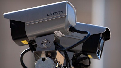 Hikvision security cameras monitor a pedestrian shopping street in Beijing, Tuesday, Oct. 8, 2019. The United States is blacklisting a group of Chinese tech companies that develop facial recognition and other artificial intelligence technology that the U.S. says is being used to repress China's Muslim minority groups.