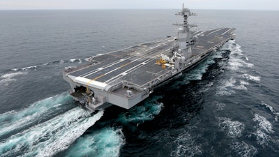 This Dec. 15, 2017, file photo shows the aircraft carrier Gerald R. Ford. The nation’s newest aircraft carrier has headed out to sea for more tests after it underwent a series of upgrades and fixes at a Virginia shipyard. The Navy said in a statement that the USS Gerald R. Ford departed Friday after spending 15 months at Newport News Shipbuilding.