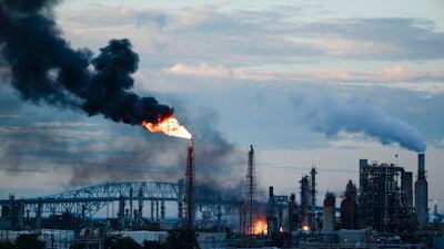 In this June 21, 2019 file photo, flames and smoke emerge from the Philadelphia Energy Solutions Refining Complex in Philadelphia. Federal investigators say an aging, failed elbow pipe appears to be the cause of the June fire and subsequent explosions that left five people with minor injuries and destroyed part of the processing unit at the largest oil refinery on the East Coast. The U.S. Chemical Safety and Hazard Investigation Board released a preliminary report Wednesday, Oct. 16 on findings from the June 21 explosion at the Philadelphia Energy Solutions Refining Complex.