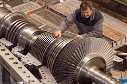 In this Oct. 14, 2009 file photo an employee of MAN Turbo company works on compressors and turbines at the factory in Oberhausen, western Germany. A German machine engineering association says that orders for German machinery, an important export, plummeted in August adding to signs of a recession in Europe’s biggest economy.