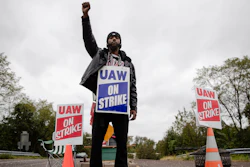 Ryan Piper with the United Auto Workers continues to picket after news of a tentative contract agreement with General Motors, in Langhorne, Pa., Wednesday, Oct. 16, 2019. Bargainers for General Motors and the United Auto Workers reached a tentative contract deal on Wednesday that could end a monthlong strike that brought the company's U.S. factories to a standstill.