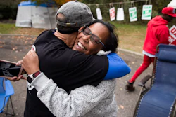 Picketing United Auto Workers Richard Rivera, left, and Robin Pinkney react to news of a tentative contract agreement with General Motors, in Langhorne, Pa., Wednesday, Oct. 16, 2019. Bargainers for General Motors and the United Auto Workers reached a tentative contract deal on Wednesday that could end a monthlong strike that brought the company's U.S. factories to a standstill.