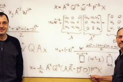 Vladimir Sukhoy and Alexander Stoytchev, left to right, with the derivation for the ICZT algorithm in structured matrix notation -- the answer to a 50-year-old puzzle in signal processing.