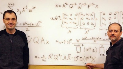 Vladimir Sukhoy and Alexander Stoytchev, left to right, with the derivation for the ICZT algorithm in structured matrix notation -- the answer to a 50-year-old puzzle in signal processing.