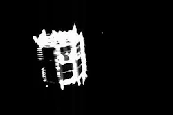 In this Oct. 3, 2019, image released by the JAXA, Japan Aerospace Exploration Agency, the rover MINERVA-II2 is captured by the wide-angle optical navigation camera (ONC-W2) immediately after separation. Radio-waves are also being received from MINERVA-II2. Japan’s space agency says its Hayabusa2 spacecraft has released a small rover that will land on the surface of an asteroid as part its final mission before heading back to Earth.