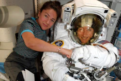 In this image released Friday, Oct. 4, 2019, by NASA, astronauts Christina Koch, right, and, Jessica Meir pose for a photo on the International Space Station. NASA has moved up the first all-female spacewalk to Thursday, Oct. 17, 2019, or Friday because of a power system failure at the International Space Station.