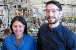 Aisulu Aitbekova, left, and Matteo Cargnello in front of the reactor where Aitbekova performed much of the experiments for this project.