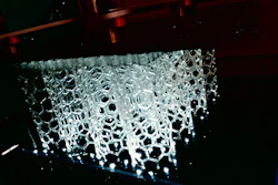HARP prints vertically, using projected UV light to cure liquid resins into hardened plastic.