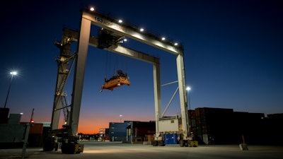 In this Jan. 30, 2018, file photo a rubber tire gantry moves into position to transfer shipping containers at the Georgia Ports Authority's Port of Savannah in Savannah, Ga. A federal watchdog is criticizing the way the Trump administration handles taxes on imported steel and aluminum, saying a lack of transparency creates the appearance of 'improper influence.' The Commerce Department's inspector general is raising questions about a process that lets steel and aluminum importers request relief from tariffs imposed in March 2018.