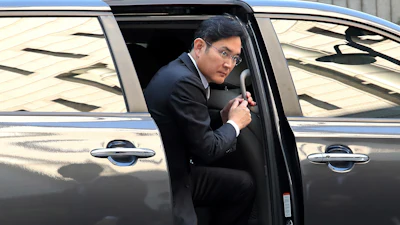 Samsung Electronics Vice Chairman Lee Jae-yong gets off a car upon his arrival at the Seoul High Court in Seoul, South Korea, Friday, Oct. 25, 2019. Billionaire Samsung scion Lee appeared in court for a retrial on corruption charges that partially fueled an explosive 2016 scandal that spurred massive protests and sent South Korea's then-president to prison.
