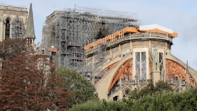 Notre Dame cathedral is pictured Tuesday, Oct. 15, 2019 in Paris. French Culture Minister Franck Riester said the melted, twisted scaffolding atop Notre Dame Cathedral will be removed 'in coming weeks' to allow restoration work to begin. It's been six months since fire gutted the medieval structure, which was under renovation at the time and crisscrossed with scaffolding where the spire once stood.