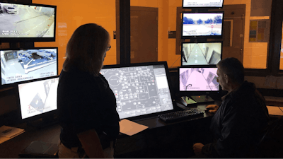 In this Sept. 12, 2019 photo, County Sheriff Janis Mangum stands in a control room at the county jail, in Jefferson, Ga. A ransomware attack in March took down the office's computer system, forcing deputies to handwrite incident reports and arrest bookings.