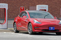 This Friday, July 19, 2019, file photo shows a Tesla vehicle charging at a Tesla Supercharger site in Charlotte, N.C. Tesla’s electric car sales accelerated again during the summer, but the company is still lagging behind the pace it needs to reach CEO Elon Musk’s goal for the entire year.