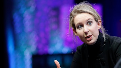 In this Monday, Nov. 2, 2015 file photo, Elizabeth Holmes, founder and CEO of Theranos, speaks at the Fortune Global Forum in San Francisco. Elizabeth Holmes, who ran Theranos until its 2018 collapse, hasn't paid her Palo Alto, California, attorney John Dwyer and his colleagues for the past year, according to documents filed Monday, Sept. 30, 2019 in Phoenix federal court.