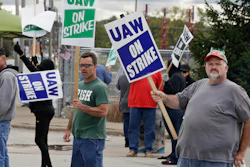 John Kirk, right, a 20-year-employee, pickets with co-workers outside the General Motors Fabrication Division, Friday, Oct. 4, 2019, in Parma, Ohio.