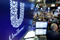 In this Thursday, March 15, 2018 file photo, the logo for Unilever appears above a trading post on the floor of the New York Stock Exchange. Consumer products giant Unilever, whose brands include Dove soaps and Lipton teas, said on Monday Oct. 7, 2019, they are pledging to halve its use of non-recycled plastics by 2025.