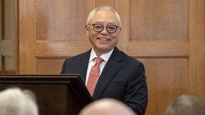 Sidney Lu, CEO of Foxconn Interconnect Technology Ltd., takes to the podium at a signing ceremony at Engineering Hall in July.