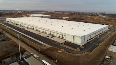 In this Jan. 27, 2018, file photo 975,000 square foot warehouse sits in Staten Island, New York. Warehouse properties are surging in value as people increasingly shop online and the popularity of quick delivery surges. Controlling warehouses in multiple locations allows companies like Amazon.com to package, ship and deliver goods often within hours of an order.