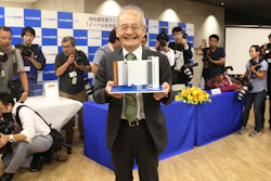 Winner of Nobel Prize of Chemistry Akira Yoshino poses a photo with a model Lithium-ion battery during a press conference in Tokyo, Wednesday, Oct. 9, 2019. Yoshino is one of the three scientists who have won this year's Nobel Prize in Chemistry for their contributions to lithium-ion batteries, which have reshaped energy storage and transformed cars, mobile phones and many other devices in an increasingly portable and electronic world.
