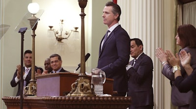 In this photo taken Feb. 12, 2019, California Gov. Gavin Newsom receives applause after delivering his first state of the state address at the Capitol in Sacramento.
