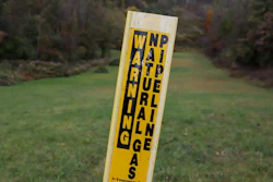In this Oct. 17, 2019, photo, a post marks the location of a shale gas pipeline in Zelienople, Pa.