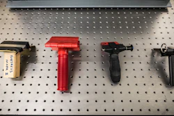 Prototypes of portable door locks at various stages in development.