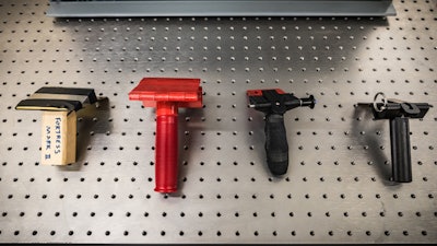 Prototypes of portable door locks at various stages in development.