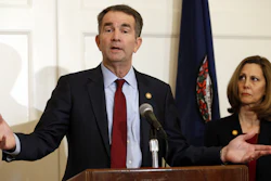 Virginia Gov. Ralph Northam, accompanied by his wife, Pam, speaks during a news conference in the governor's mansion in Richmond, Feb. 2, 2019.