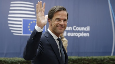In this Oct. 20, 2016, file photo, Dutch Prime Minister Mark Rutte waves as he arrives for the EU summit in Brussels.