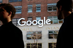 In this Dec. 4, 2017, file photo, people walk by Google offices in New York.