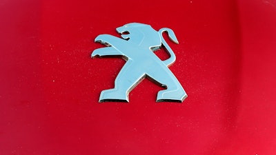 Peugeot logo on a car in Bayonne, France, Oct. 31, 2019.