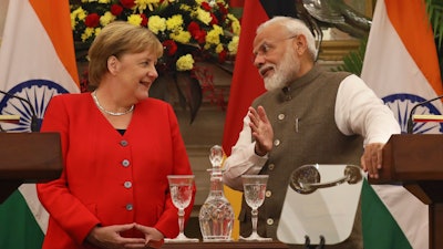 Indian Prime Minister Narendra Modi talks with German Chancellor Angela Merkel during a signing ceremony in New Delhi, Nov. 1, 2019.