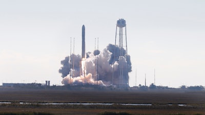 Spectators watch as Northrop Grumman's Antares rocket lifts off the launch pad at NASA Wallops Flight facility in Wallops Island, Va., Saturday, Nov. 2, 2019. The rocket is carrying a Cygnus spacecraft carrying supplies to the International Space Station.