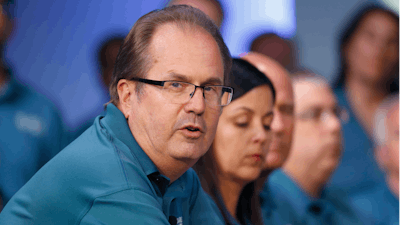 In this July 16, 2019, file photo, Gary Jones, United Auto Workers President, speaks during the opening of their contract talks with Fiat Chrysler Automobiles in Auburn Hills, Mich. Jones is taking a paid leave of absence amid a federal investigation of corruption in the union. The UAW said Jones requested the leave, which is effective Sunday, Nov. 3. The federal government has been investigating fraud and misuse of funds at the UAW for more than two years.