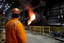In this June 28, 2018, file photo, senior melt operator Randy Feltmeyer watches a giant ladle after pouring red-hot iron at the U.S. Steel Granite City Works in Granite City, Ill.