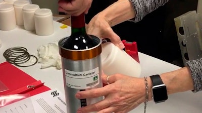 In this Saturday, Nov. 2, 2019 photo provided by Space Cargo Unlimited, researchers with Space Cargo Unlimited prepare bottles of French red wine to be flown aboard a Northrop Grumman capsule from Wallops Island, Va., to the International Space Station. The wine will age for a year up there before returning to the Luxembourg company. Company officials say researchers will study how weightlessness and space radiation affect the aging process.