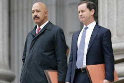 Ted Wells, Jr., left, the lead attorney for Exxon, leaves Manhattan Supreme court with a colleague Nov. 7, 2019.