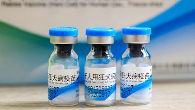 In this July 24, 2018, file photo, bottles of rabies vaccines made by Liaoning Chengda are seen at a Chinese Center for Disease Control and Prevention station in Jiujiang.