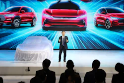 In this April 16, 2019, file photo, Wang Chuanfu, chairman and president of BYD Auto, prepares to show the latest cars during Auto Shanghai 2019.