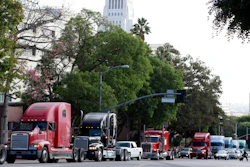 In this Nov. 13, 2009, file photo, a caravan of trucks drive around Los Angeles City Hall during a protest against container fees.