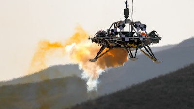 A lander is lifted during a test of hovering, obstacle avoidance and deceleration capabilities at a facility in Huailai in China's Hebei province, Thursday, Nov. 14, 2019. China has invited international observers to the test of its Mars lander as it pushes for inclusion in more global space projects. Thursday's test was conducted at a site outside Beijing simulating conditions on the Red Planet, where the pull of gravity is about one-third that of Earth.
