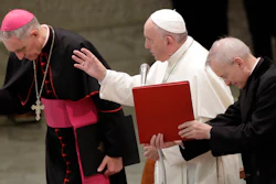 Pope Francis delivers his blessing in the Paul VI Hall at the Vatican at the end of an audience with students and teachers of the LUMSA Catholic University, Nov. 14, 2019.