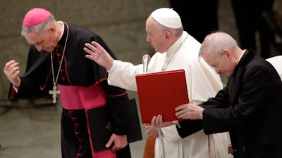 Pope Francis delivers his blessing in the Paul VI Hall at the Vatican at the end of an audience with students and teachers of the LUMSA Catholic University, Nov. 14, 2019.