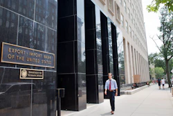 In this July 28, 2015, file photo, a man walks past the Export-Import Bank of the United States in Washington.