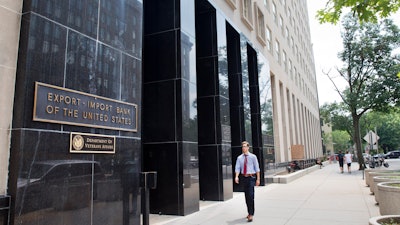 In this July 28, 2015, file photo, a man walks past the Export-Import Bank of the United States in Washington.