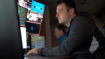 In this Nov. 7, 2019, photo taken from video, technicians monitor video feeds from 38 cameras placed around State Farm Arena in Atlanta in order to produce 3 dimensional video replays.